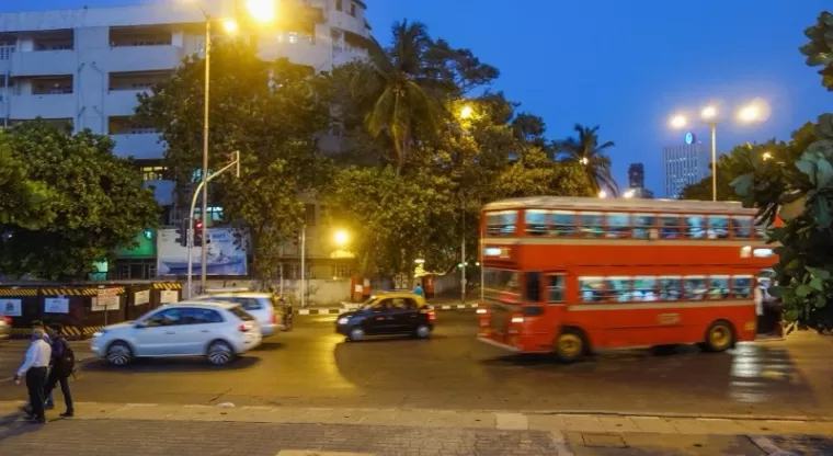 Red double-decker bus at Nariman Point in the evening, Mumbai